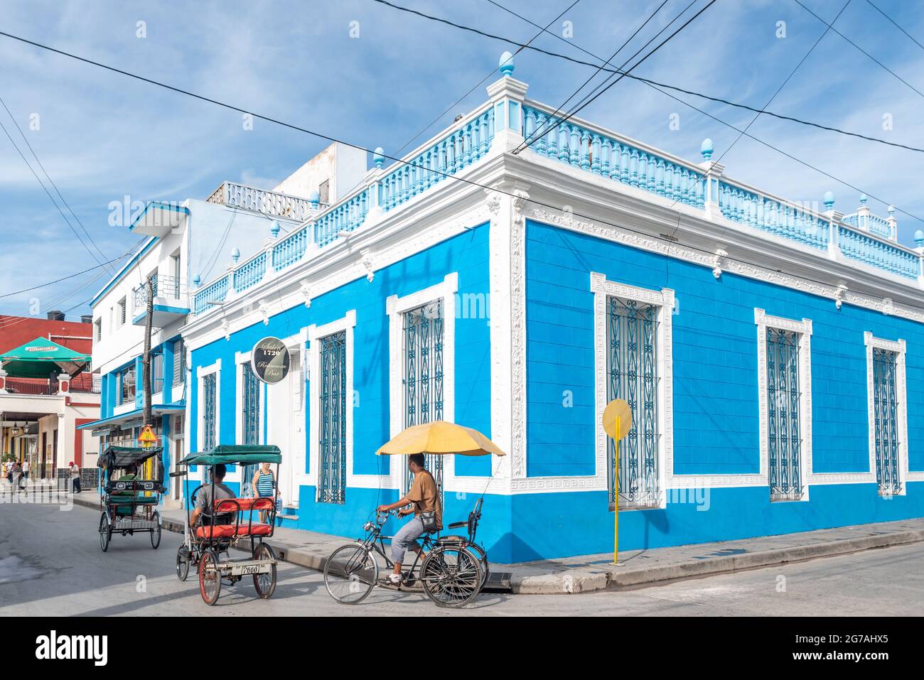 City life by the bar restaurant Salon 1720 in Holguin, Cuba, 2016 Stock Photo