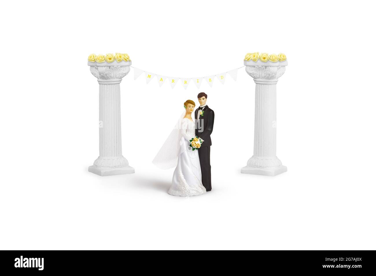 Wedding day concept with bride and groom cake toppers Stock Photo - Alamy