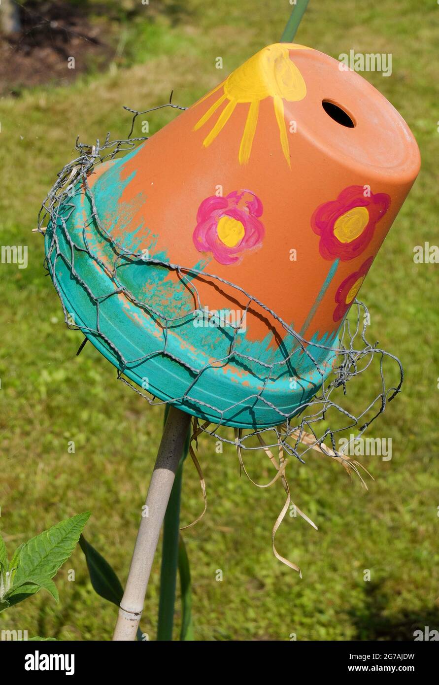 Brightly painted pot as an ear pecker shelter (Dermaptera) Stock Photo