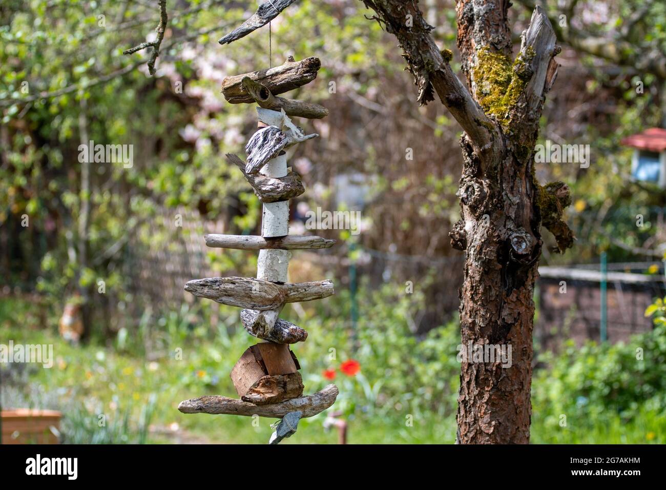 wind chimes made with branches and wood pieces Stock Photo