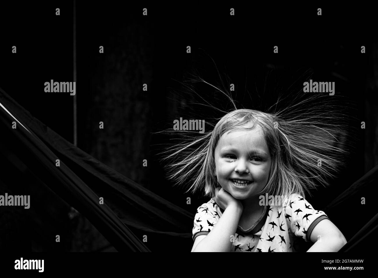 Blond girl with static hair Stock Photo