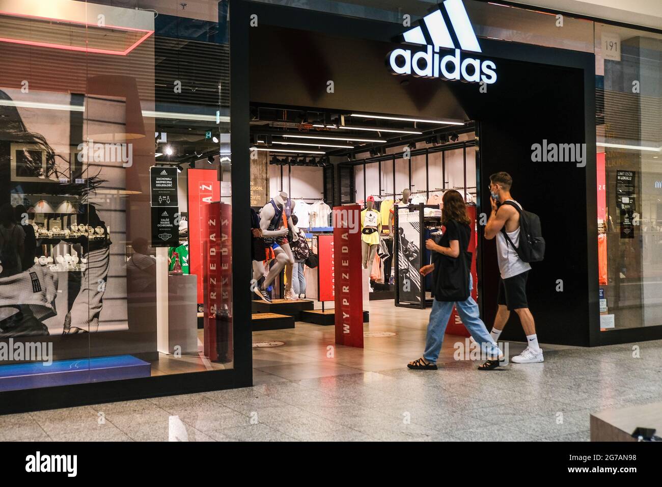 Krakow, Poland. 12th July, 2021. People seen entering an Adidas shop inside a shopping mall. (Photo by Omar Images/Sipa USA) Credit: Sipa USA/Alamy Live News Stock Photo - Alamy