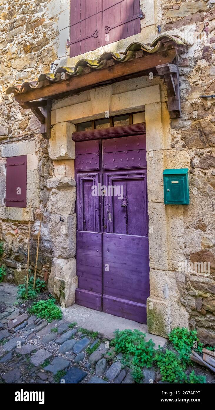 Colored front door in Lugné. Stock Photo