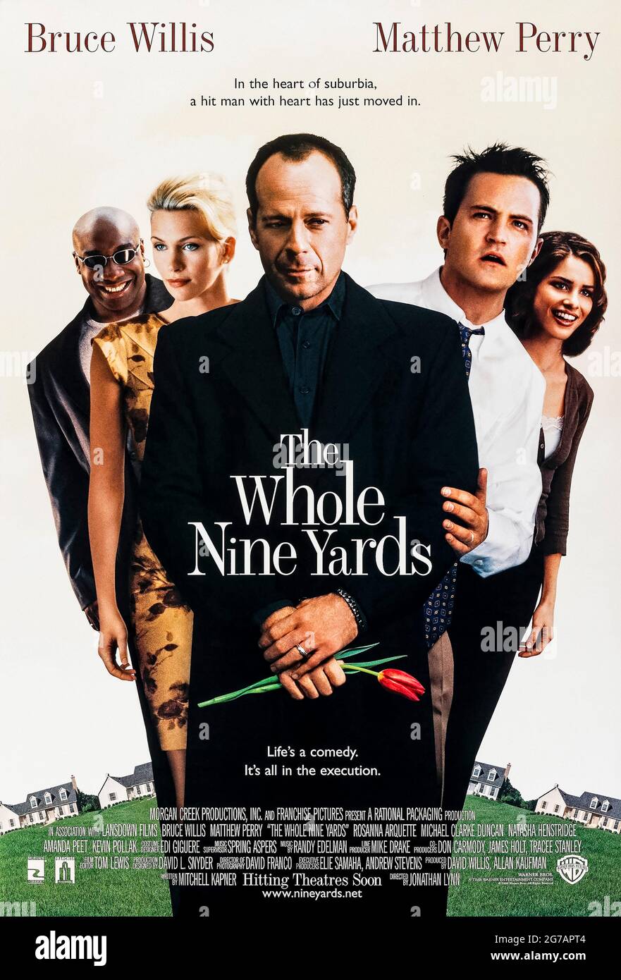 The Whole Nine Yards (2000) directed by Jonathan Lynn and starring Bruce Willis, Matthew Perry and Rosanna Arquette. Comedy about a struggling dentist's life is turned upside down when an infamous hitman turned police informer moves in next door. Stock Photo