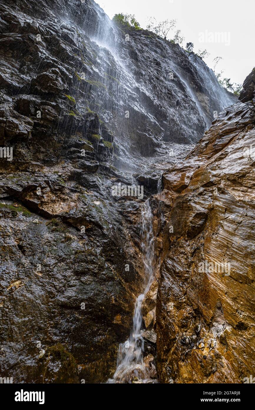 Waterfall over the rock face in the Höllentalklamm, Grainau, Upper Bavaria, Germany Stock Photo