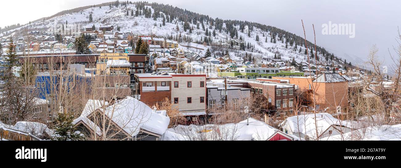 Colorful houses and buildings on a snow-covered hill at Park City in Utah Stock Photo