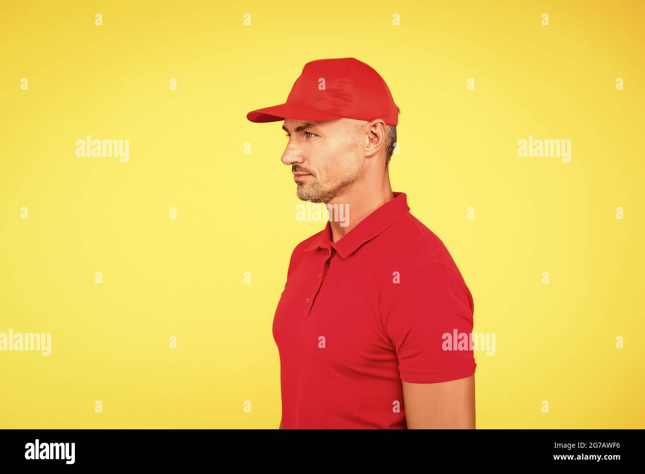 Targeted Delivery Services. Cashier shop staff. Black friday. Freight transportation. Perfect delivery. Delivery man yellow background. Free services Stock Photo