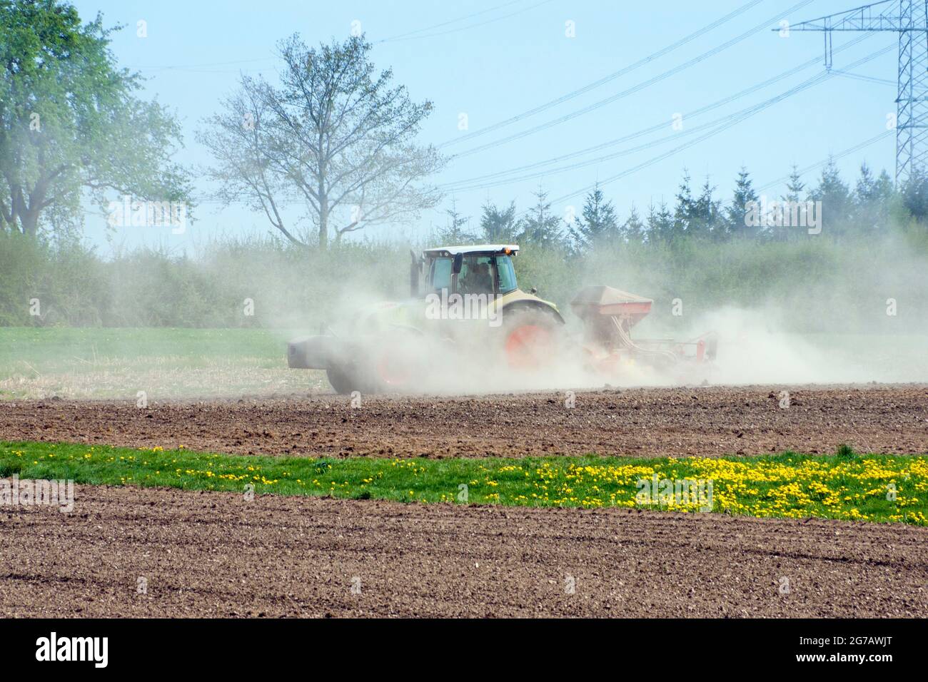 Germany, Baden-Wuerttemberg, Löffingen-Bachheim, farmer does field work with tractor. Stock Photo