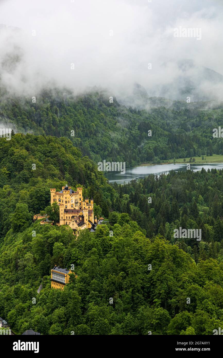 View of Hohenschwangau Castle and surroundings with low clouds, Schwangau, Upper Bavaria, Germany Stock Photo