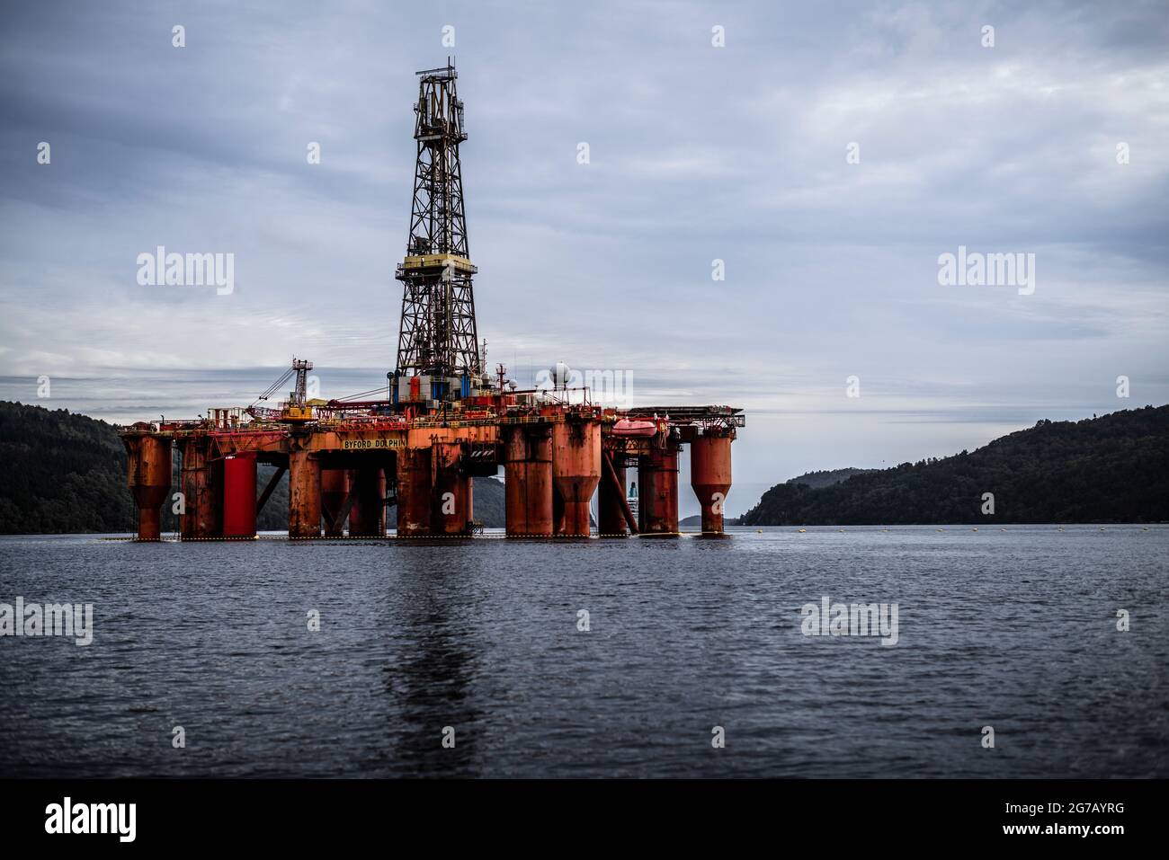 Oil rig in fjord Stock Photo