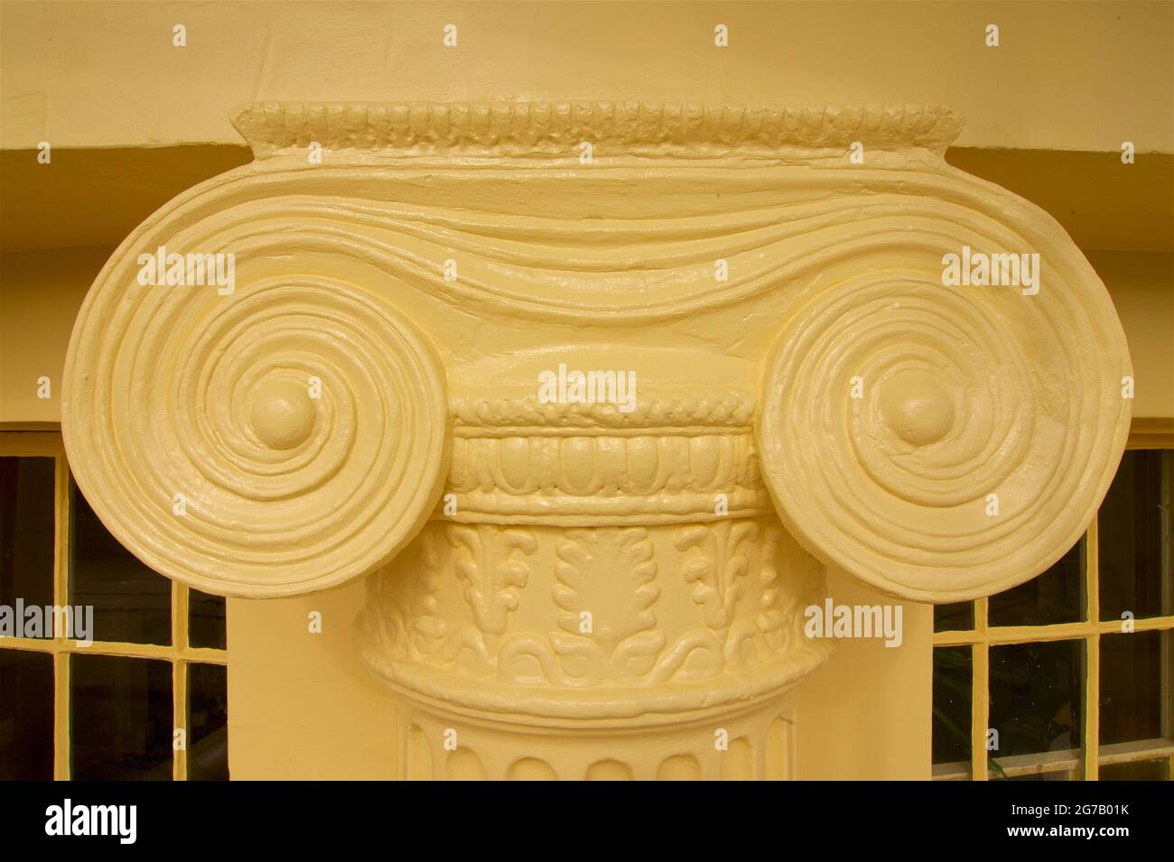 Freshly repaired Ionic volutes on a capital atop a column in the Regency development of Brunswick Square in Hove, adjoining Brighton, Sussex, England, UK. These buildings are Grade I listed and require repainting every 5 years by law. Stock Photo