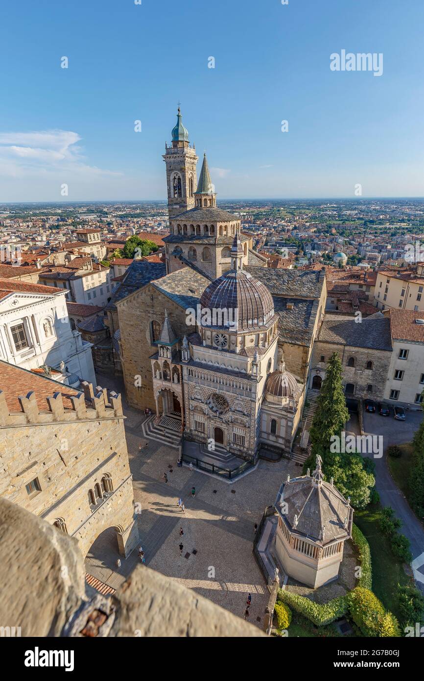 Bergamo, Italy - July 10, 2021: street view of Bergamo Alta citadel in full daylight, people are visible in the distance. Stock Photo