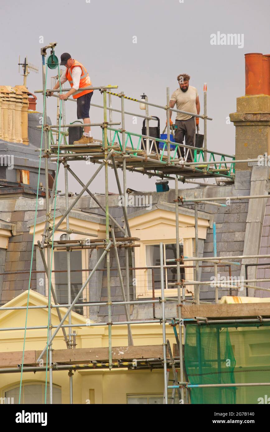 Scaffolding on the roof with workmen, Brunswick Square Hove East Sussex