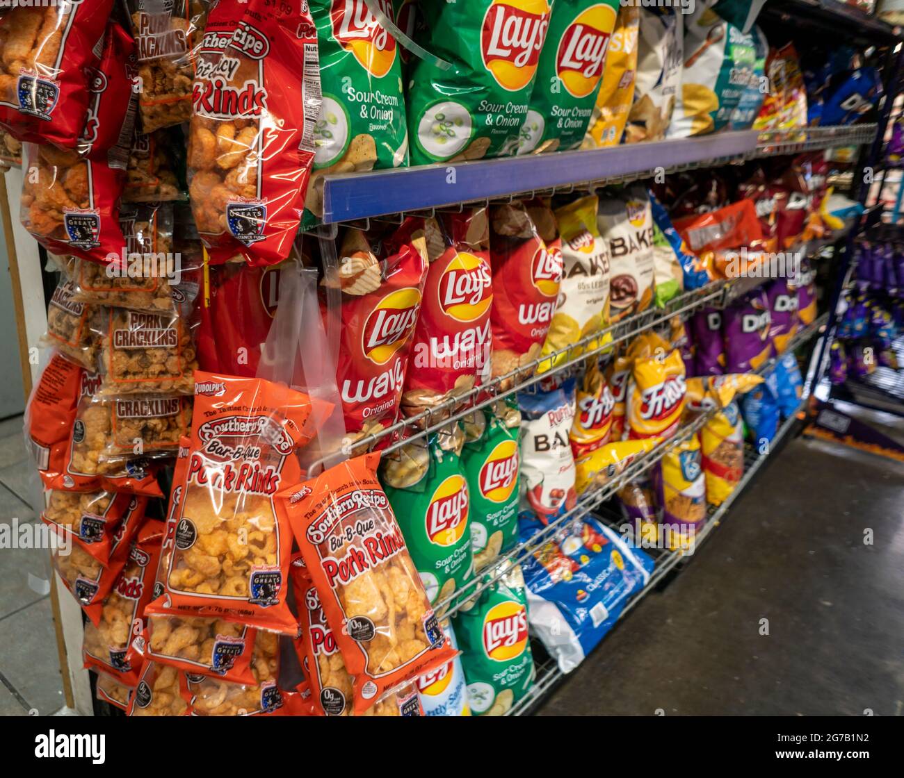 A display of tasty but not particularly healthy snacks including pork rinds and Frito-Lay brand chips in New York on Tuesday, July 6, 2021. Frito-Lay is a brand of Pepsico. (© Richard B. Levine) Stock Photo
