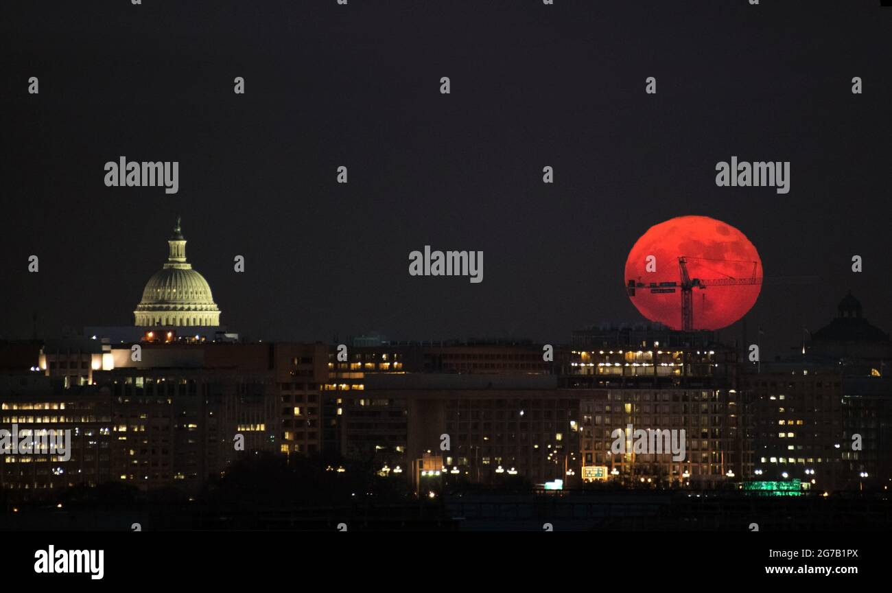 The Moon, a 'Supermoon',  is seen as is rises, 3 December 2017, Washington DC.    A supermoon occurs when the Moon is closer to Earth in its orbit than usual. As the second full moon of the month, this moon is also commonly known as a blue moon,  A unique, optimised and digitally optimised version of an NASA image by senior NASA photographer Bill Ingalis / credit NASA. Stock Photo