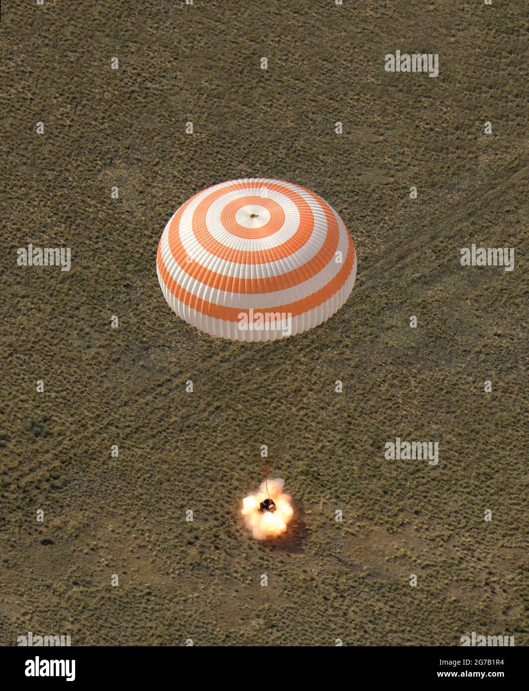 The Soyuz MS-11 spacecraft lands in a remote area near the town of Zhezkazgan, Kazakhstan with Expedition 59 crew members Anne McClain of NASA, David Saint-Jacques of the Canadian Space Agency, and Oleg Kononenko of Roscosmos, 25 June 2019 . Returning from the International Space Station.  A unique, optimised and digitally enhanced version of an NASA image by senior NASA photographer Bill Ingalis / credit NAS. Stock Photo