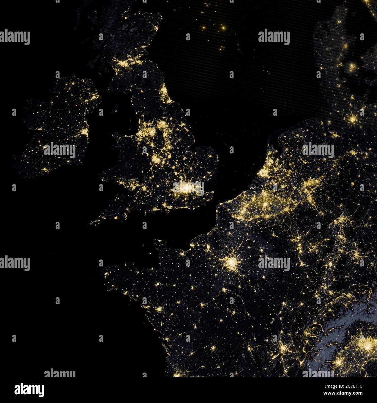 City lights and illuminated highways photographed from space. The UK, Ireland, France and neighbouring countries photographed from Space on the night of 27 March 2012. by the  Suomi National Polar-orbiting Partnership satellite. The image was acquired by the Visible Infrared Imaging Radiometer Suite (VIIRS) on Suomi NPP.  A unique, optimised and digitally enhanced version of an NASA image / credit NASA Stock Photo