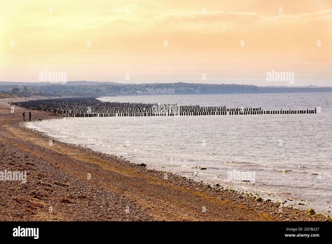 Beach with groynes in the foreground with a view of Heiligendamm, Mecklenburg-Western Pomerania, Germany Stock Photo