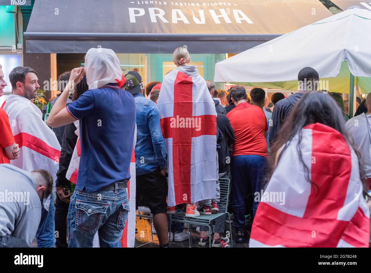 Exploding Flags Euros Football football fans wrap England flags watching Euros 2020 match between ...