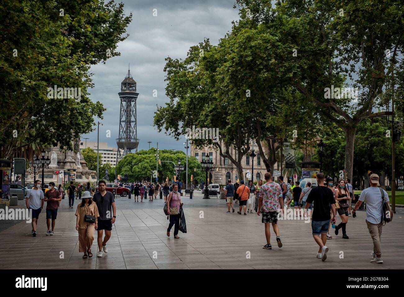 Barcelona, Spain. July 12, 2021, Barcelona, Spain: Commuters, much of them  tourists, walk along La Rambla in Barcelona. Spain is among EU countries  with highest coronavirus infection rates, some regions are reimposing