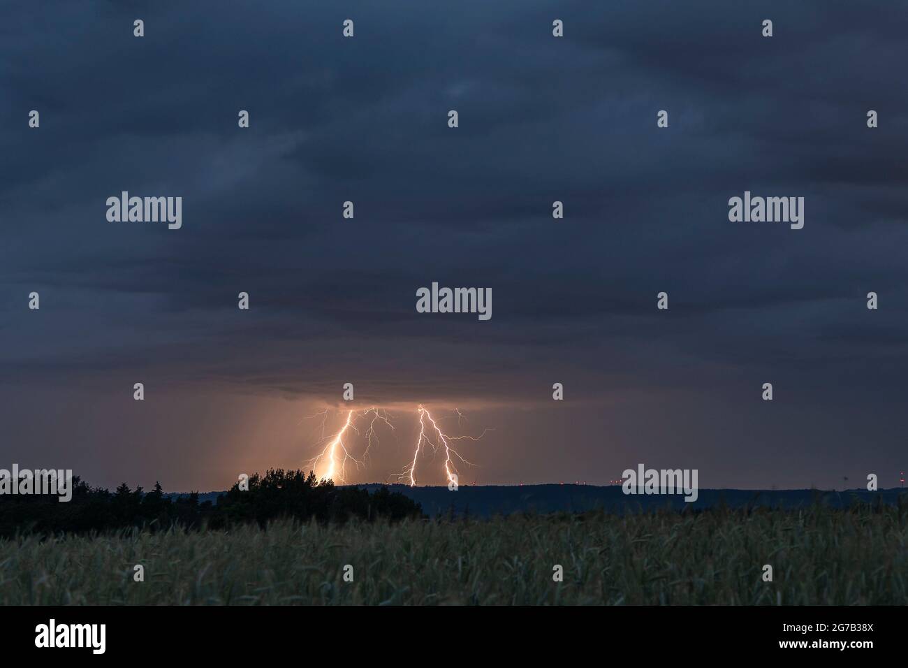 Thunderstorm with lightning strikes in Thuringia. Stock Photo