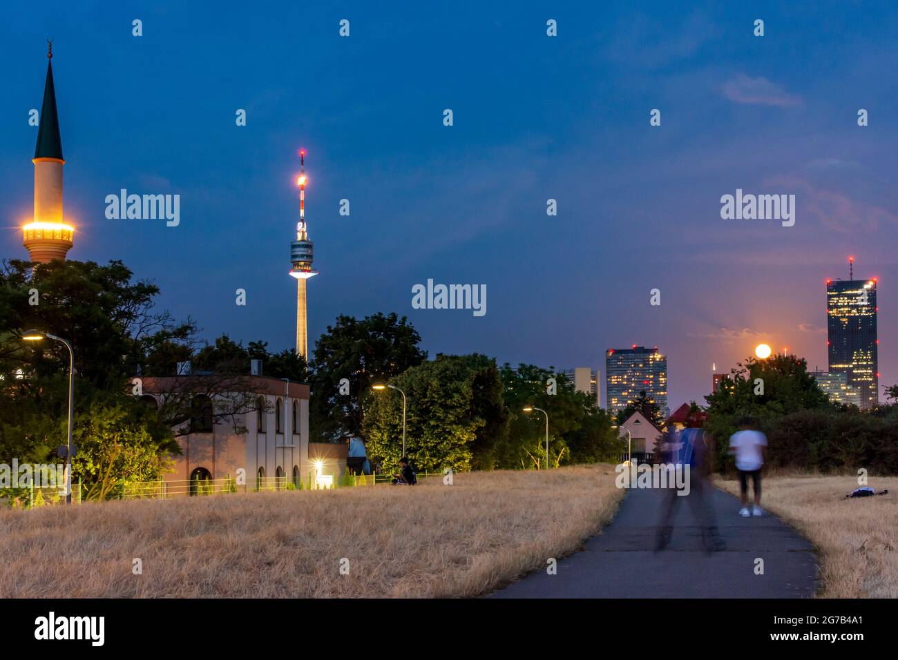 Vienna, mosque of Islamisches Zentrum Wien (Islamic Center Vienna), tower Donauturm, DC Tower 1, full moon in 22. Donaustadt, Wien, Austria Stock Photo