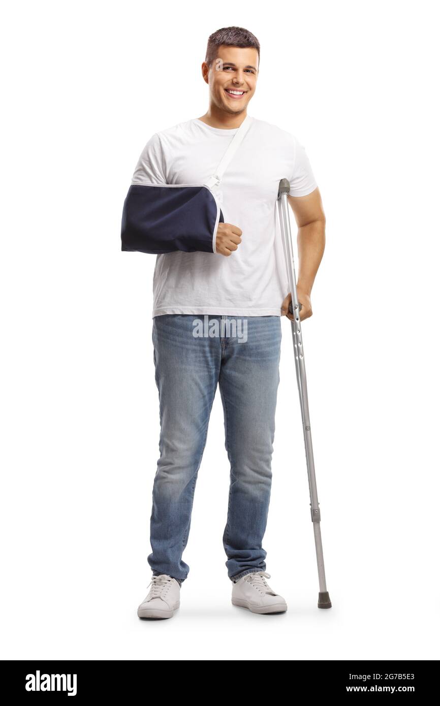 Full length portrait of a young man with a broken arm wearing an arm