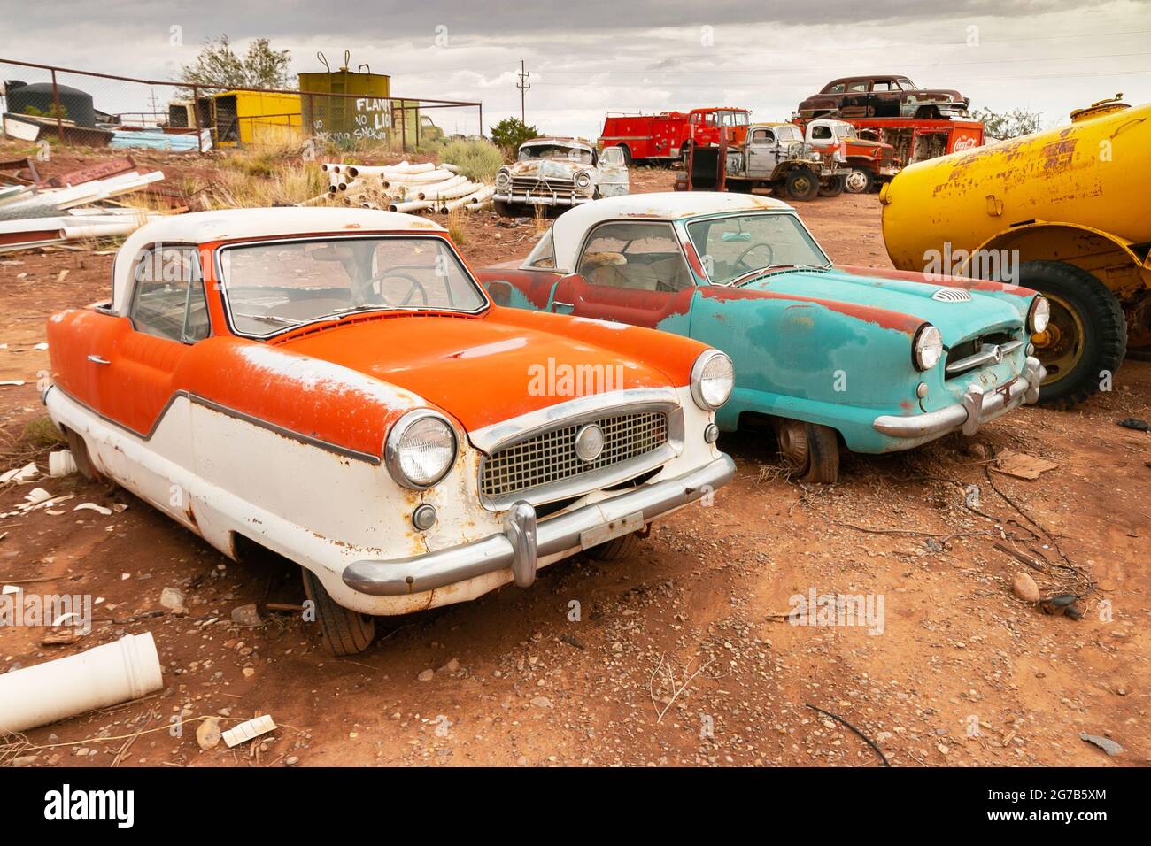 junkyard of old rusty Nash Metropolitan American cars at Salvage yard