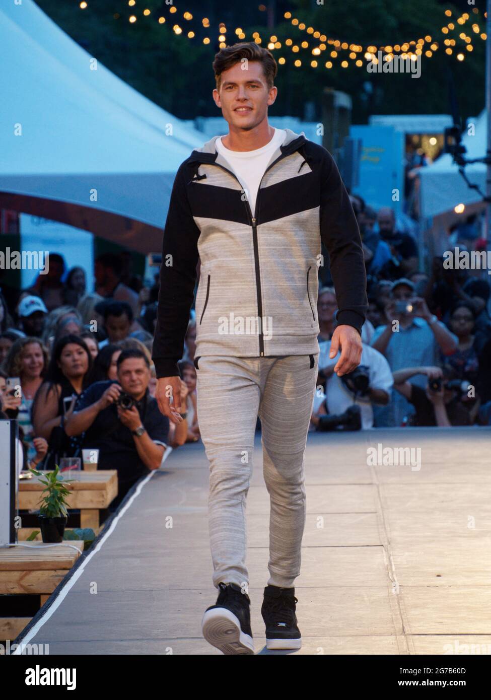 A Male Model Walks The Runway In Stylish Modern Black Business During A  Fashion Show. Fashion Catwalk Event Showing New Collection Of Clothes.  Stock Photo, Picture and Royalty Free Image. Image 88012155.
