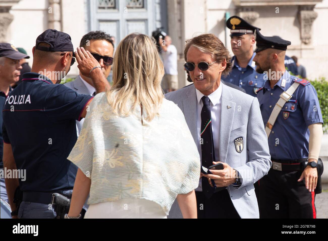 Rome, Italy. 12th July, 2021. Roberto Mancinithe player of the Italian National Football Team enter the Quirinal Palace in Rome to visit the President of the Republic Sergio Mattarella after the victory of the European Football Championships, raising the cup won to the sky. The Italian tennis player Matteo Berrettini, finalist at the Wimbledon tournament, also attended the ceremony (Photo by Matteo Nardone/Pacific Press/Sipa USA) Credit: Sipa USA/Alamy Live News Stock Photo