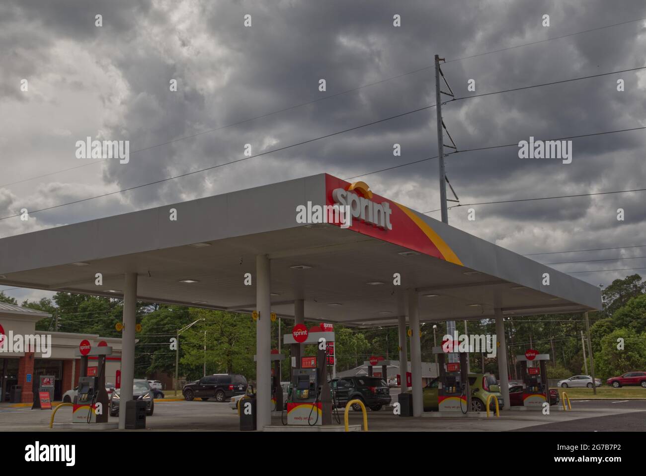 Augusta, Ga USA 04 15 21 Corner view of Sprint gas station and convenience store with storm
