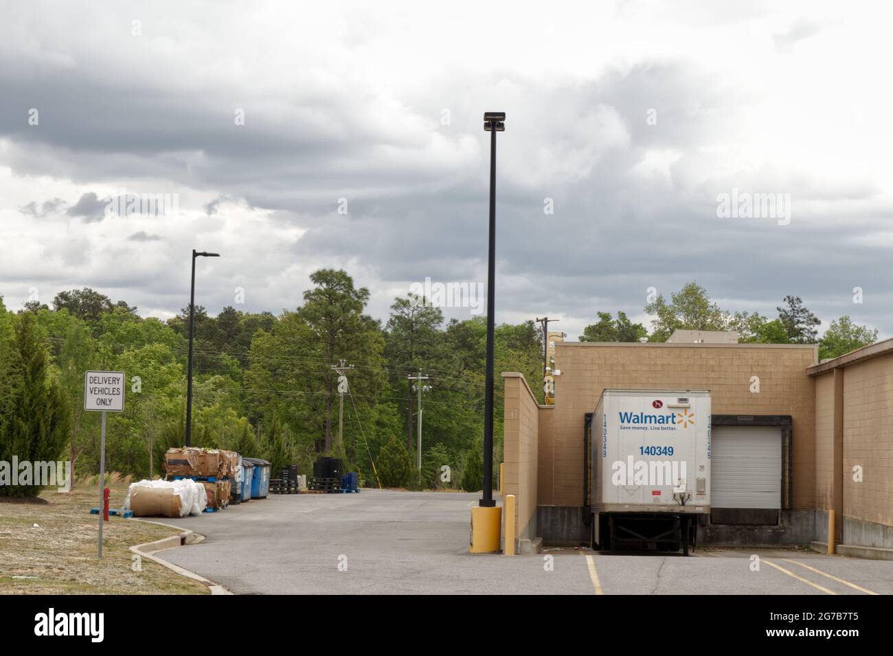 Augusta, Ga USA - 04 15 21: Behind a Walmart store pallets bales dumpsters  - Tobacco Road Stock Photo
