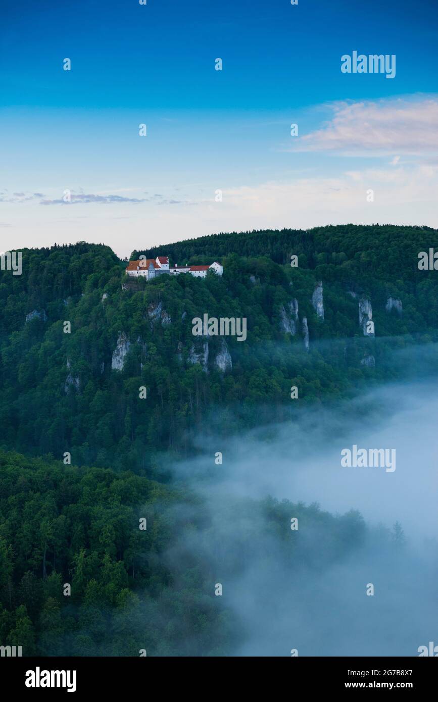 View from Eichfelsen to Wildenstein Castle with morning fog, sunrise, near Irndorf, Upper Danube nature Park, Upper Danube Valley, Danube, Swabian Stock Photo