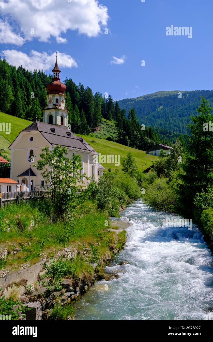 River Sill and parish church of the Visitation of the Virgin Mary, Gries am Brenner, Wipptal, Tyrol, Austria Stock Photo