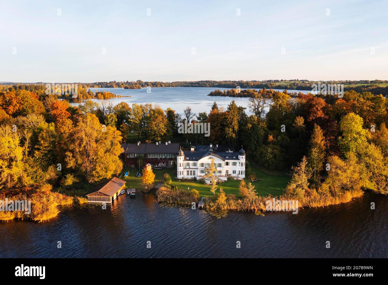 Conclusion or estate on Woerth Island, Staffelsee, morning light in autumn, drone shot, Alpine foothills, Upper Bavaria, Bavaria, Germany Stock Photo