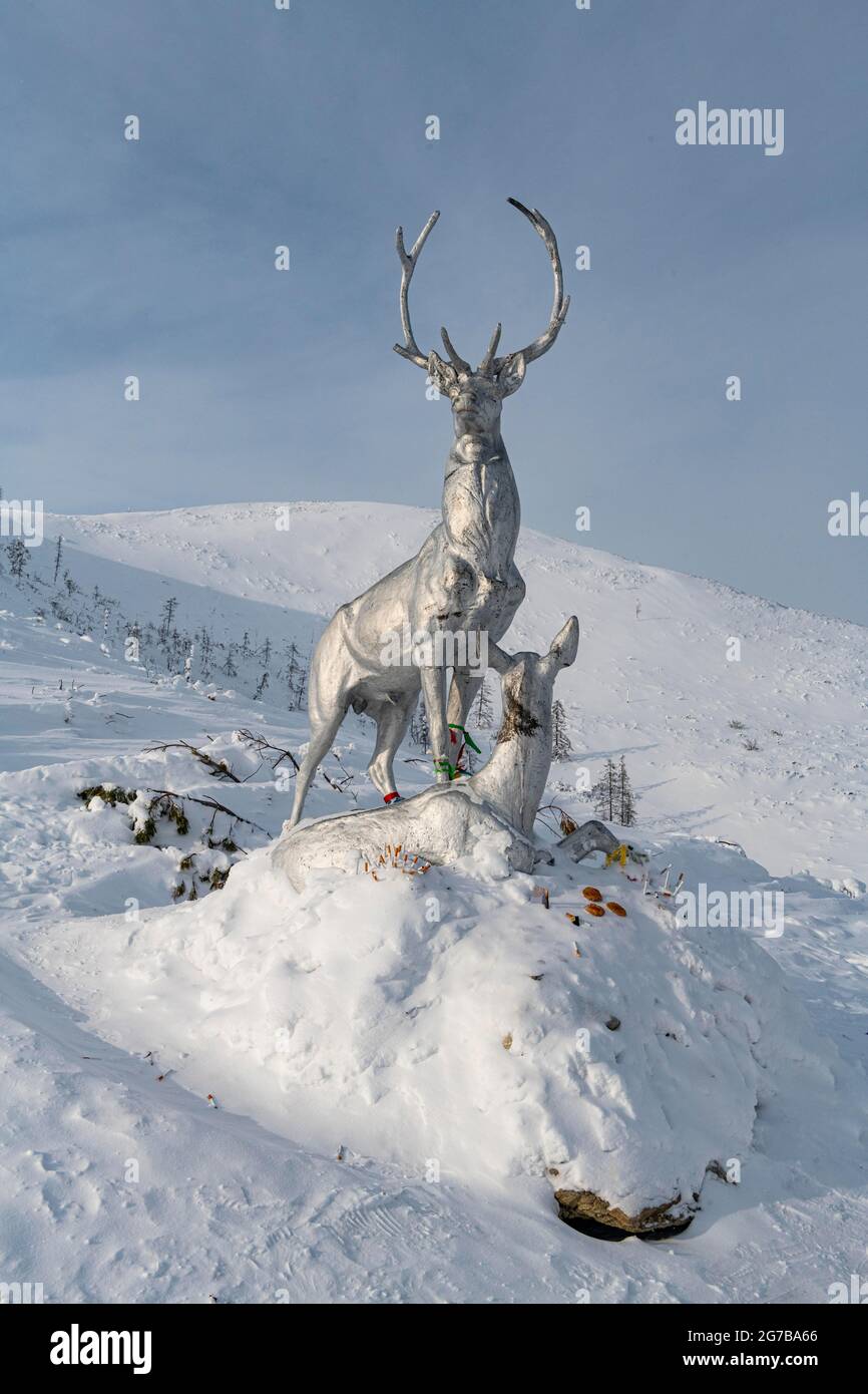 Deer monument on a snow covered mountain pass, Suntar-Khayata mountain Range, Road of Bones, Sakha Republic, Yakutia, Russia Stock Photo