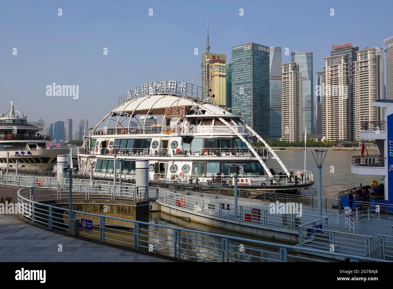View from a pier across the Huangpu River to the skyline of the Pudong Special Economic Zone, Shanghai, People's Republic of China Stock Photo