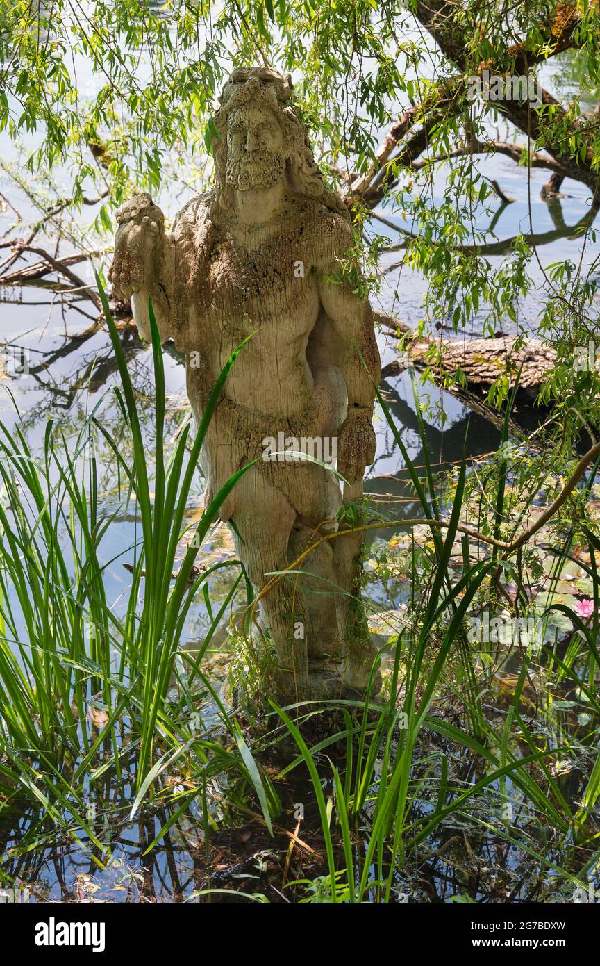 Sculpture of Hercules by Erwin Franz Wiegerling with weeping willow, Seeon Monastery, Upper Bavaria, Bavaria, Germany Stock Photo