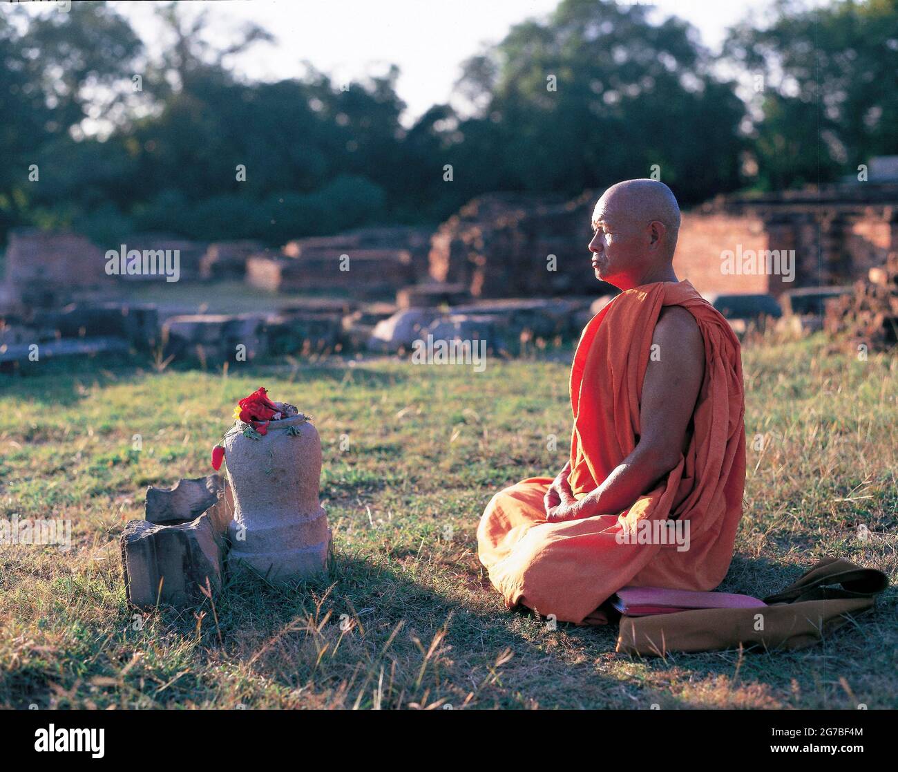 Monk praying at Sarnath, buddhist site Sarnath near Varanasi; Uttar Pradesh; India Stock Photo