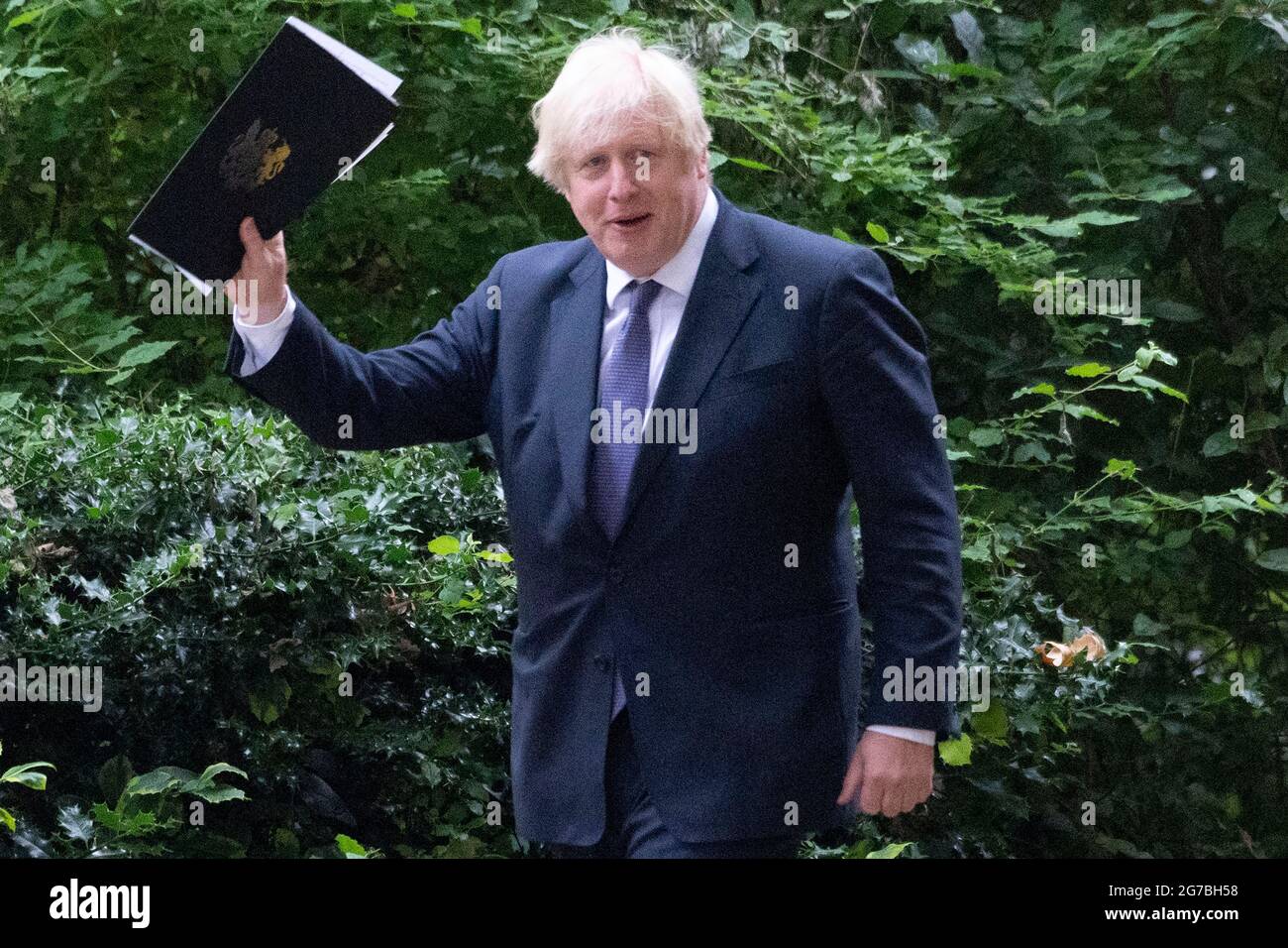 London, Britain. 12th July, 2021. British Prime Minister Boris Johnson walks back to Downing Street after attending a press conference in London, Britain, on July 12, 2021. The British government confirmed Monday that most COVID-19 restrictions in England will end next week despite surging cases caused by the Delta variant first identified in India. Credit: Ray Tang/Xinhua/Alamy Live News Stock Photo