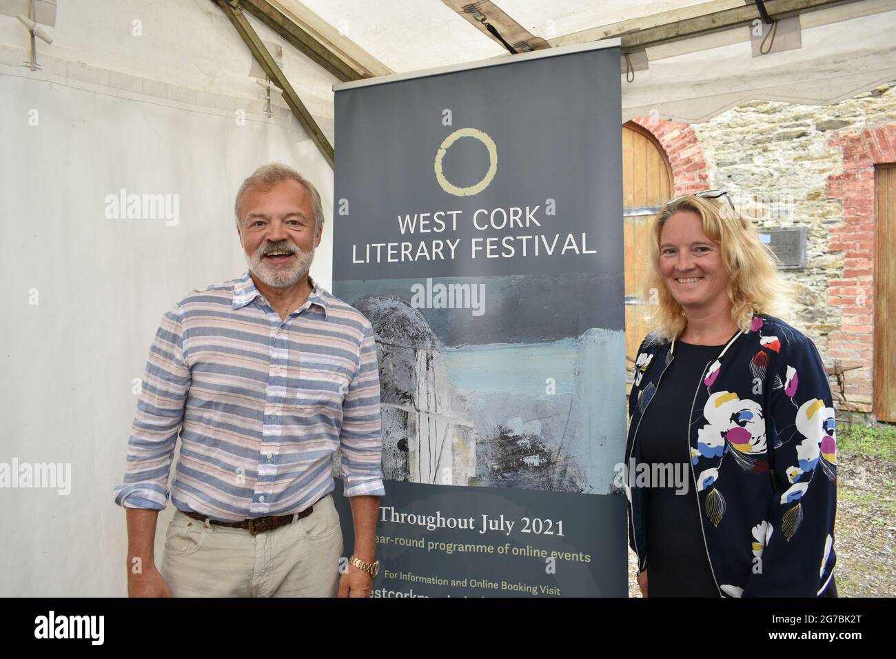 Bantry, West Cork, Ireland. 12th July 2021. West Cork Literary Festival last day of live outdoor events featuring numerous writers. Pictured below book writer and presenter Graham Norton and West Cork Literary Festival Festival Director Eimear O’Herlihy (on the right). Credit: Karlis Dzjamko/Alamy Live News Stock Photo