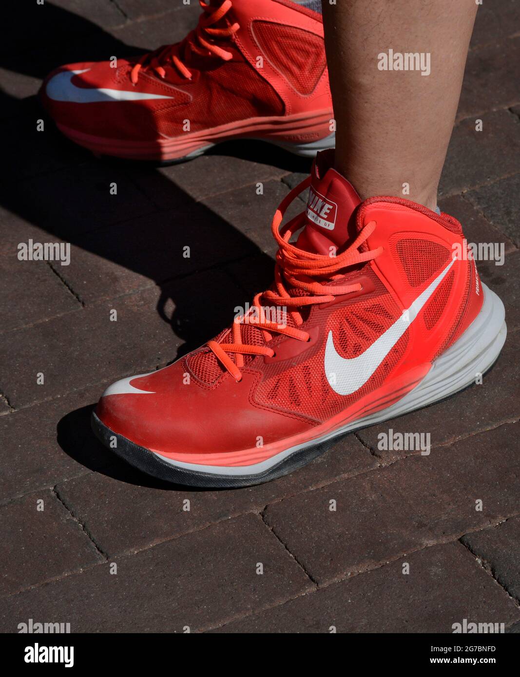 A man wears a pair of red Nike Prime Hype DF tennis or athletic shoes in  Santa Fe, New Mexico Stock Photo - Alamy