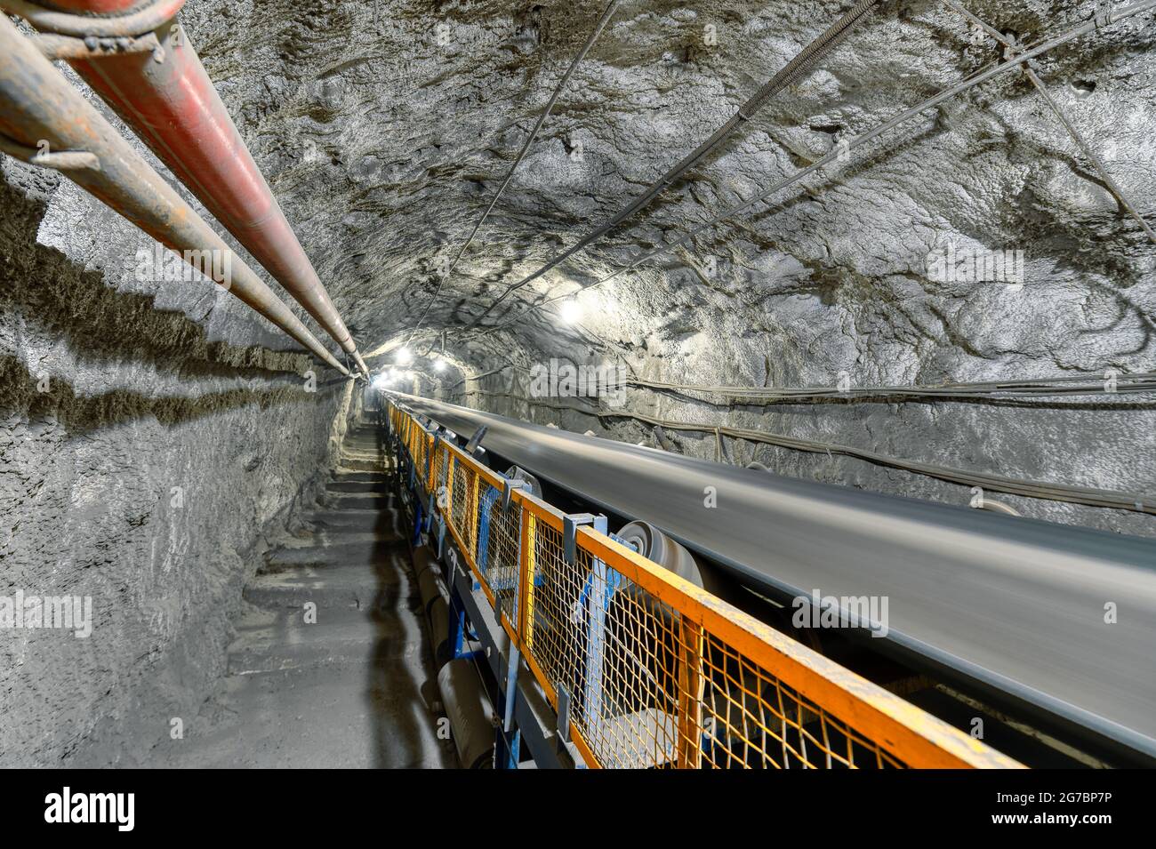 Underground belt conveyor for transporting ore to the surface Stock Photo