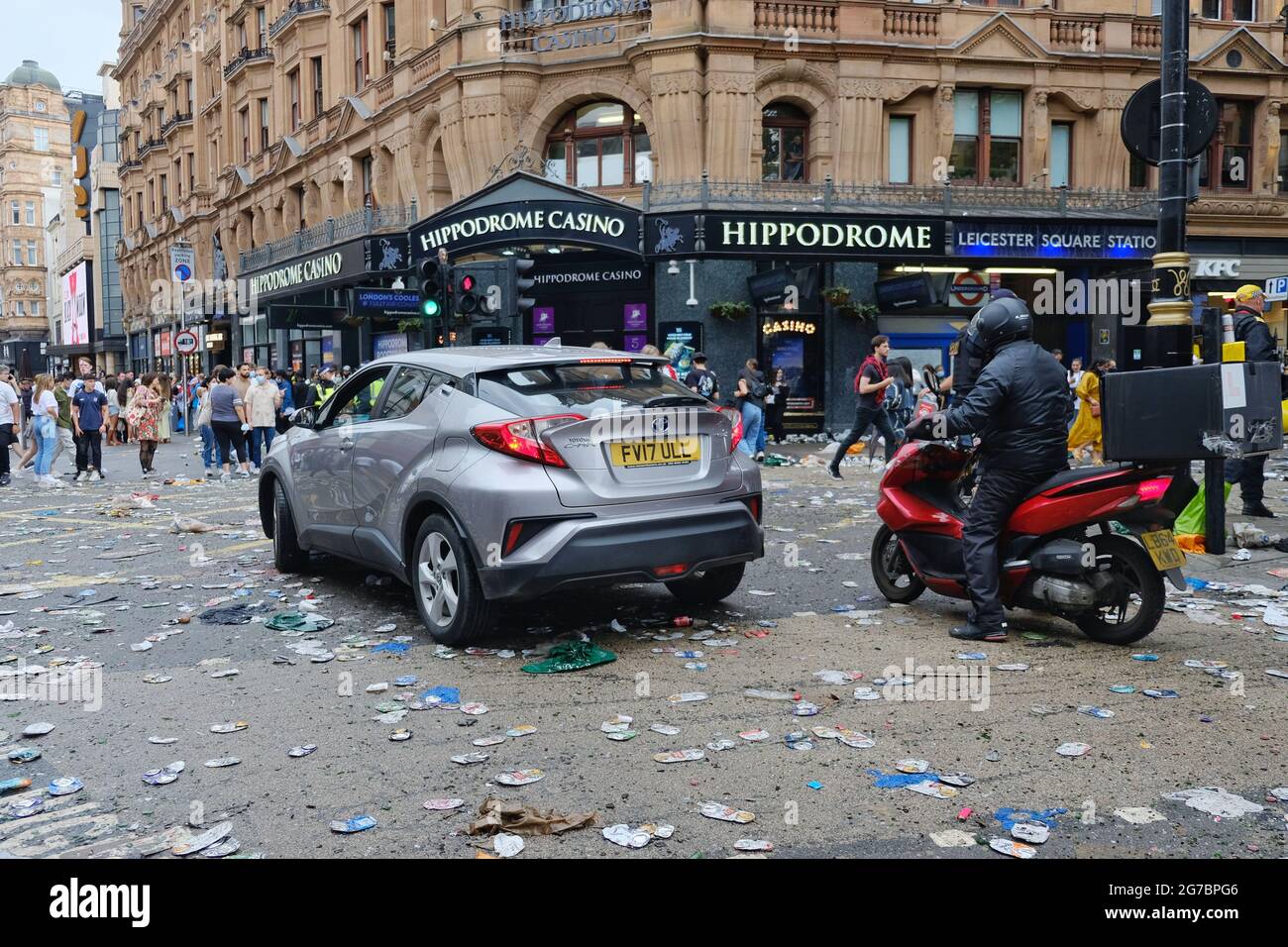 Empty beer cans and other detritus litters the road after football fans are steered away from Leicester Square before Euro 2020 final Stock Photo