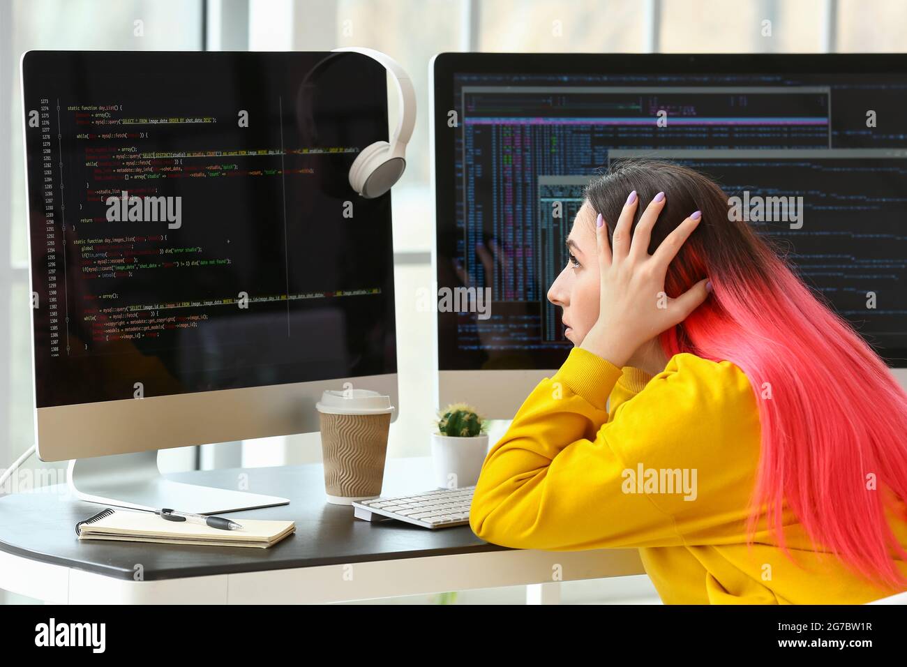 Female programmer working with computer in office Stock Photo - Alamy