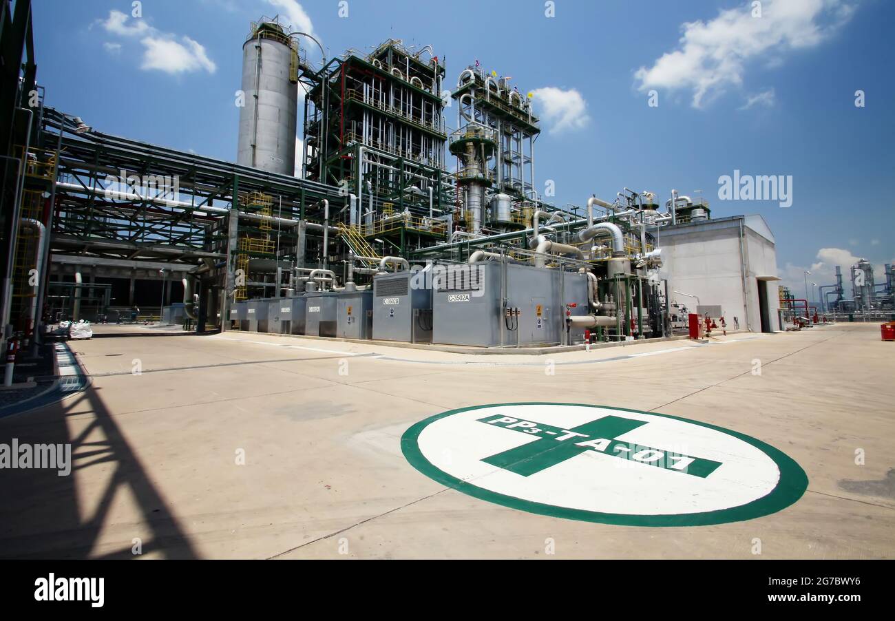 Chemical industry plant with safety first mark on the junction of the road Stock Photo