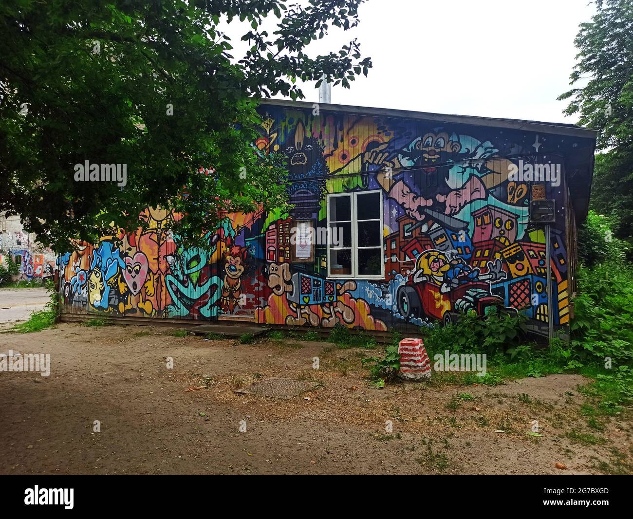 Copenhagen, Denmark - July 2021: Colorful graffiti wall of a small building in Freetown Christiania area. Stock Photo