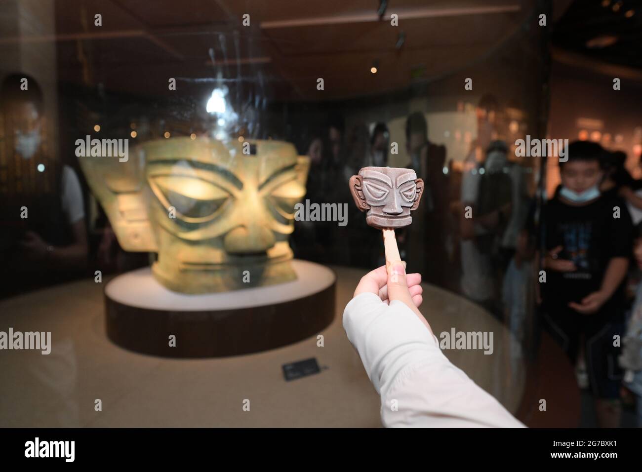 Bronze masks shaped ice creams are seen at the Sanxingdui Museum in ...