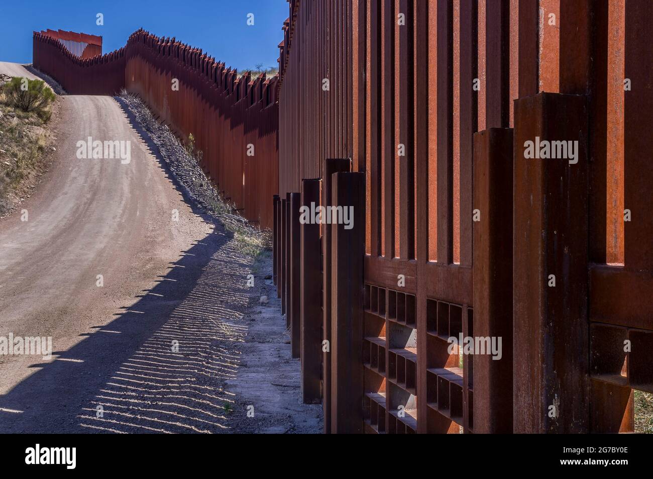US border fence on the Mexico border, east of Nogales Arizona USA, and Nogales Sonora Mexico, viewed from US side, approximately 4 miles east of the P Stock Photo