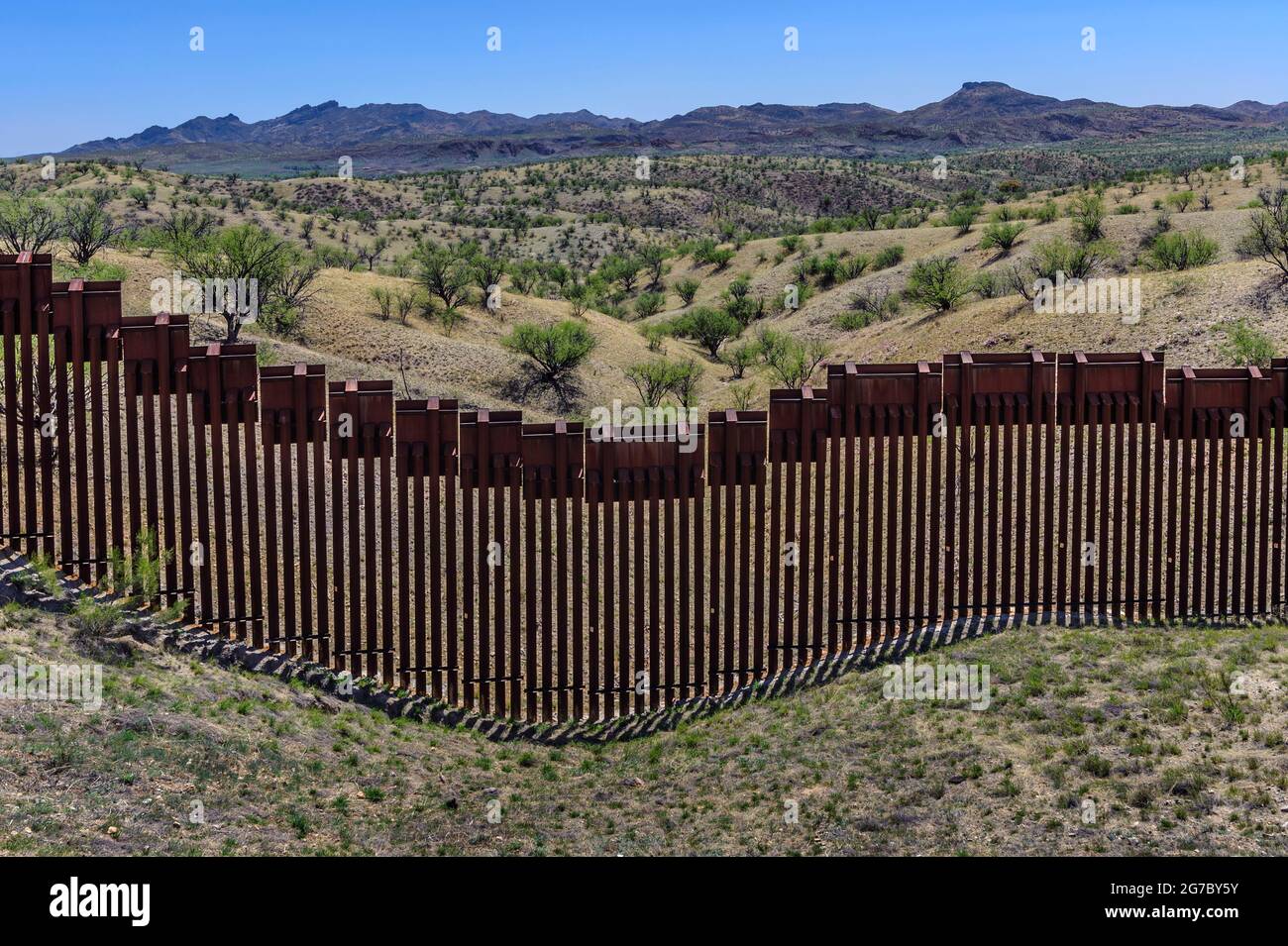 US border fence on the Mexico border, east of Nogales Arizona USA, and Nogales Sonora Mexico, viewed from US side, looking due south. Stock Photo